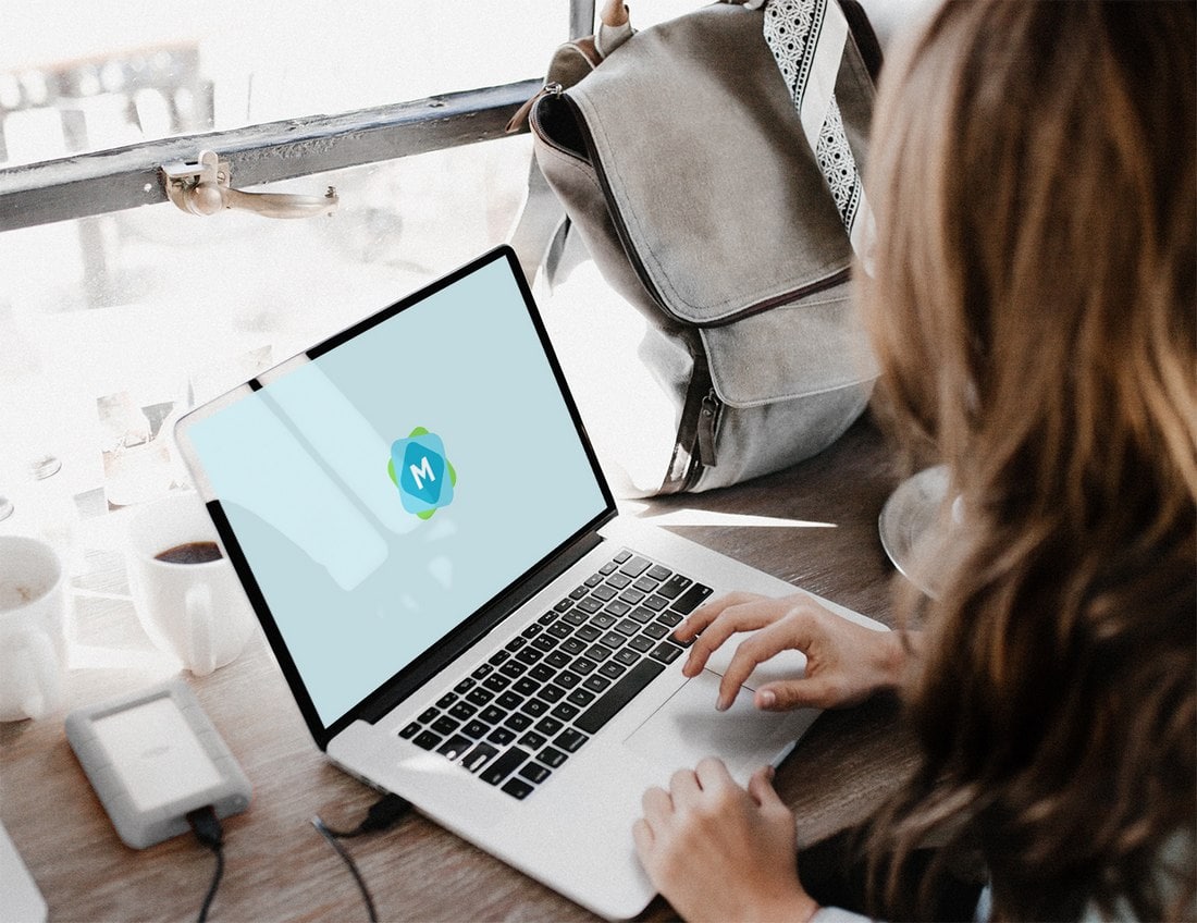 Free Woman Using a MacBook Mockup